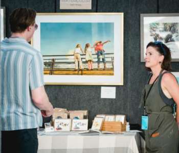 person looking at art prints person looking at art prints